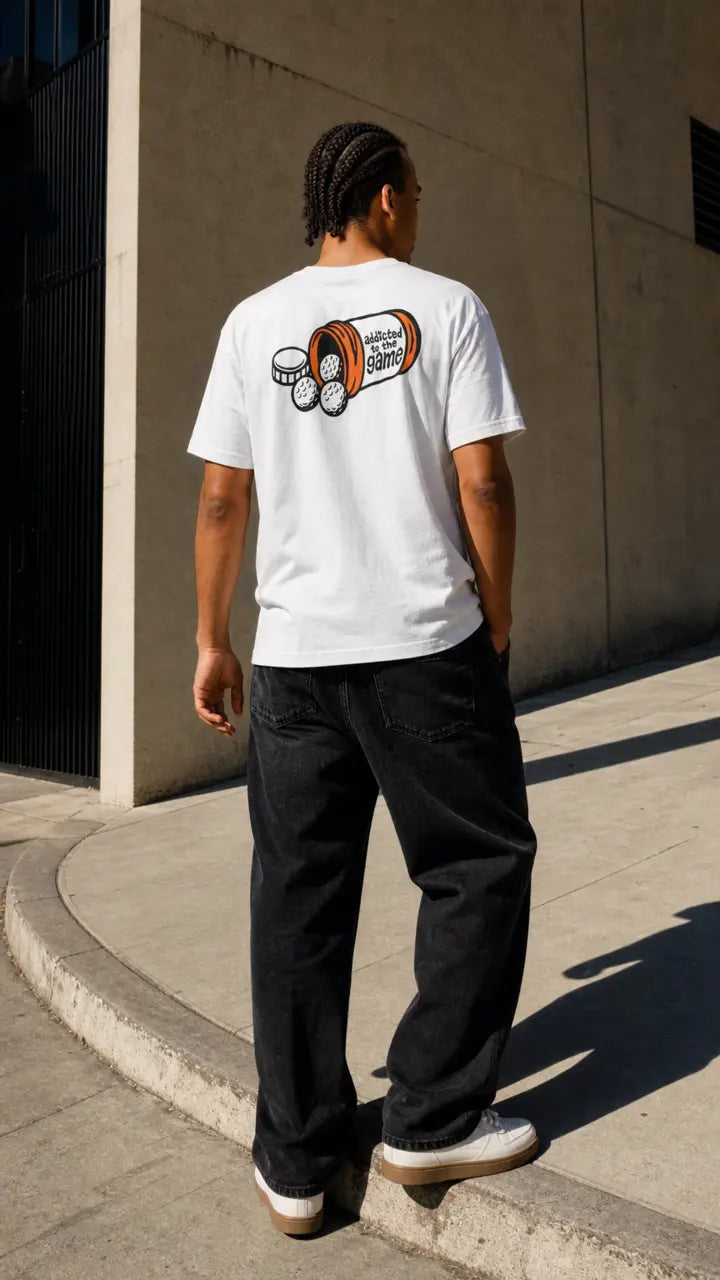 Model wearing the white Doc's Orders Tee with the Addicted to the Game back graphic